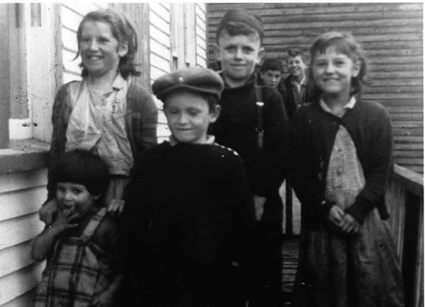 055: l-r front, Julia and Calvin Kerrivan; middle, Jenny, Rudy, and Marie Kerrivan; back, Joe Norman and Tom Kerrivan. At Margaries Cove. (circa 1961) [courtesy of Sadie (Norman) Kerrivan]  - Calvin and Rudy sons of Leo Kerrivan &amp;amp; Sade Norman; Julia, Jenny, Marie and Tom children of Joseph Kerrivan &amp;amp; Madeline Bennett; Joe son of Peter Norman and Margaret Norman."
